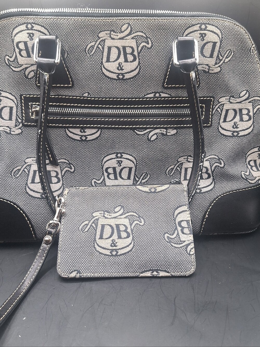 Dooney and Bourke Black & Gray Canvas & Leather Satchel Dome Bag is a large